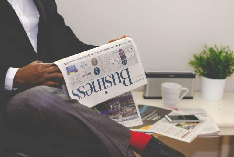 Investor Reading Business Newspaper